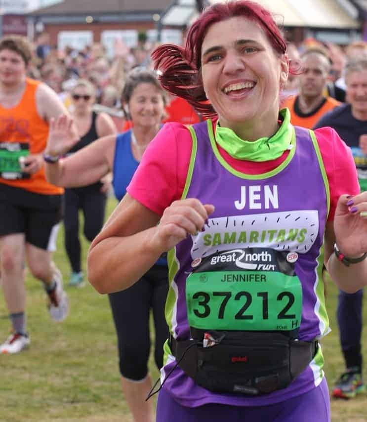 Jen running the great north run in aid of Samaritans. She looks happy as she finishes the race