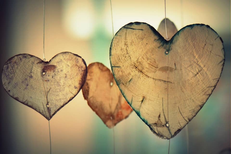 Three wooden hearts hanging 