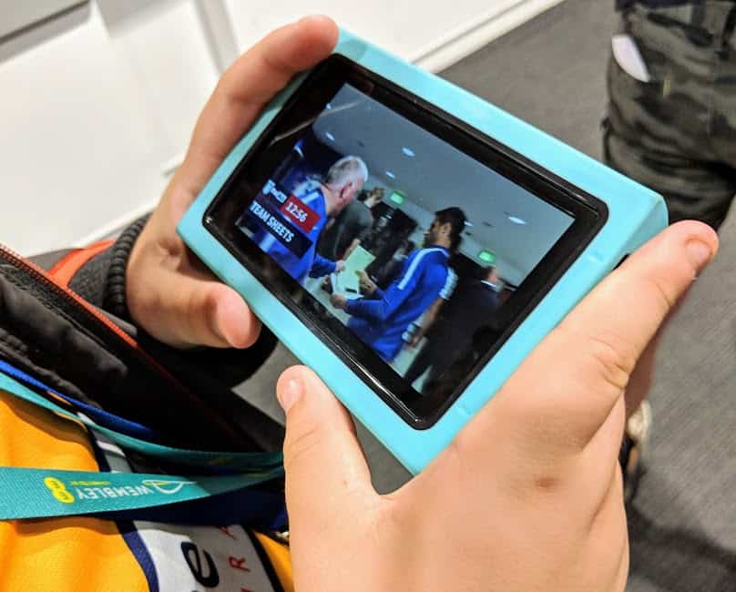 Person holding a blue smart device