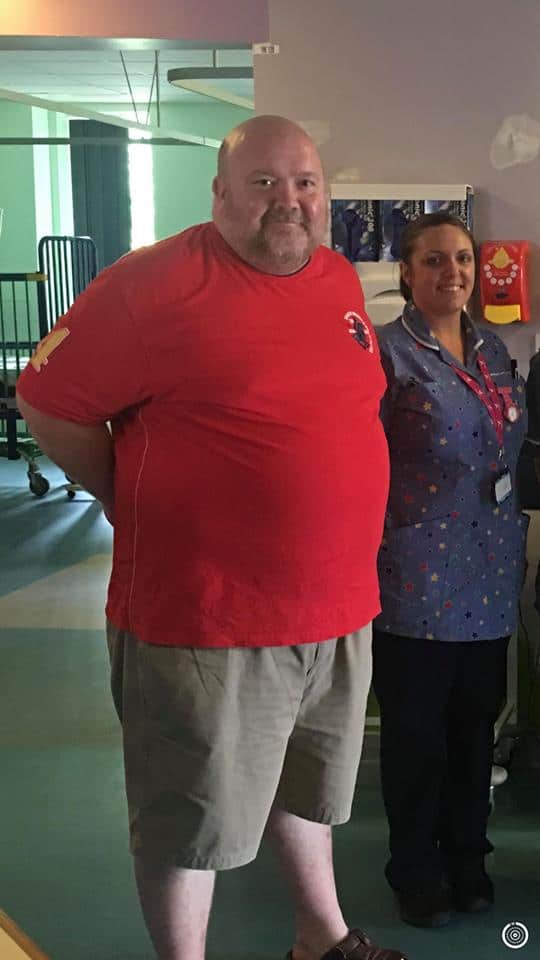 Adam at a hospital with a nurse