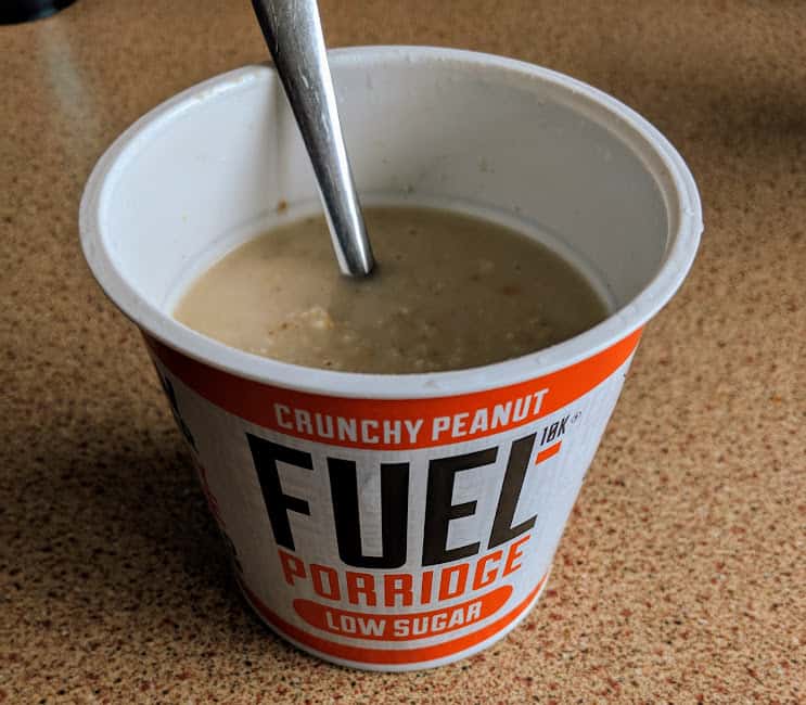 fuel crunchy peanut porridge pot on worktop made up with a spoon in