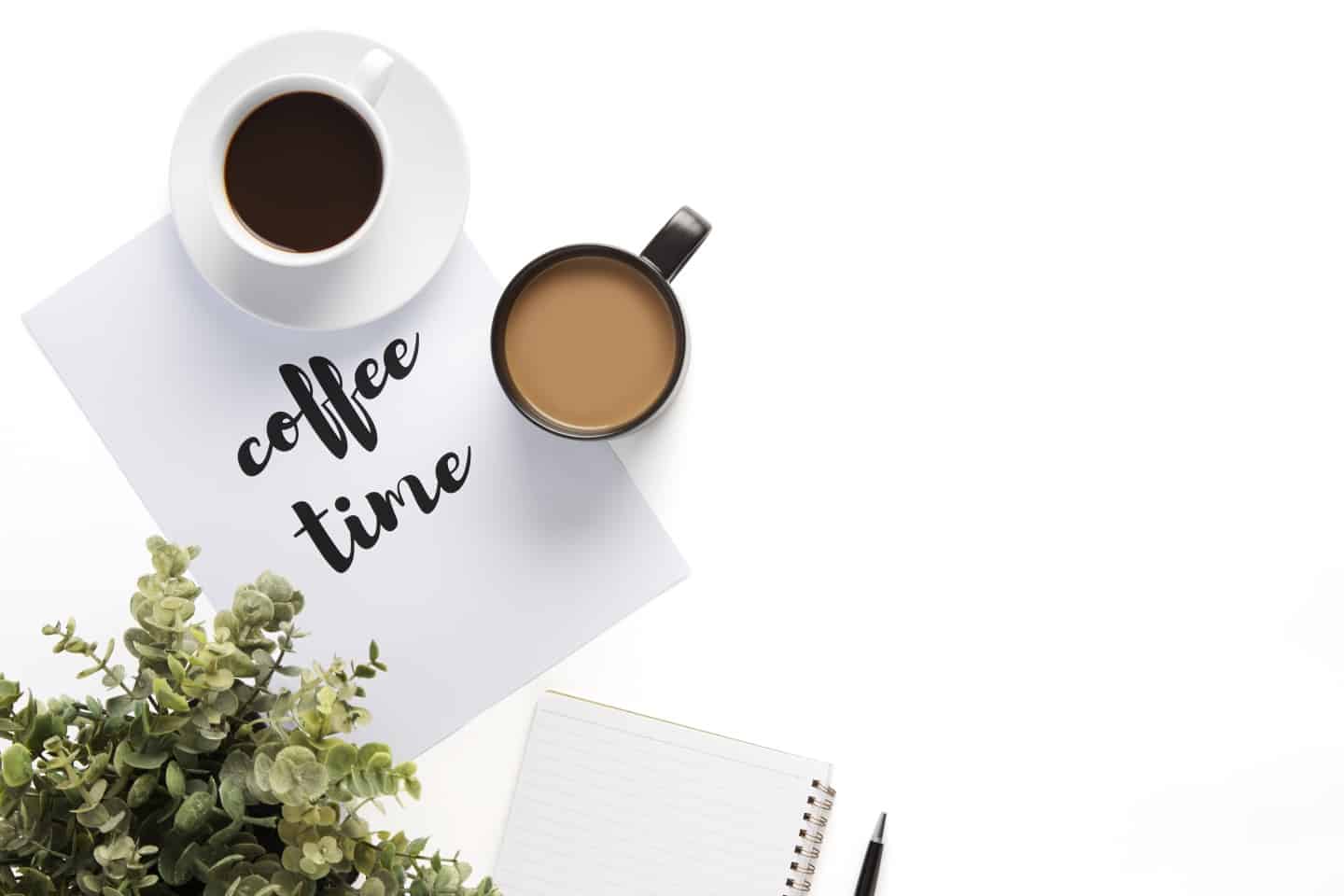 coffee time on printed sheet of paper with a couple of coffee mugs.