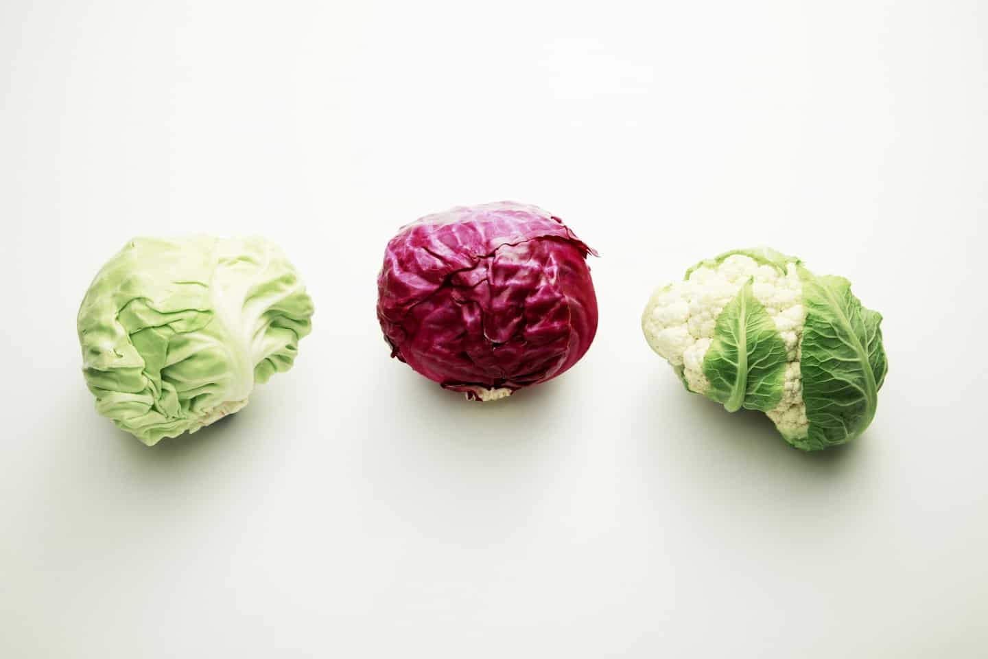cabbages and cauliflower on white background.