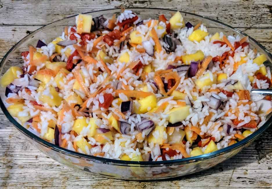 An oval dish of Caribbean rice using boiled rice cooked perfectly