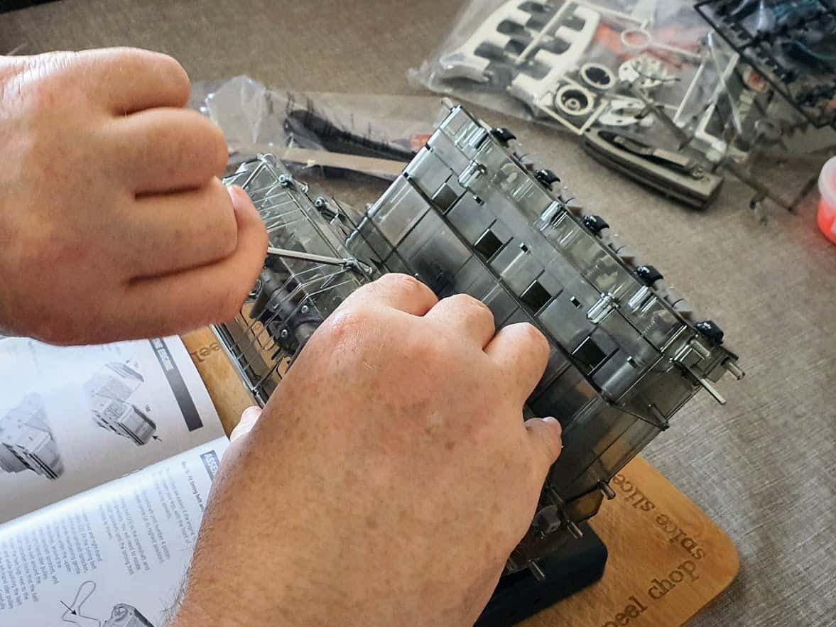 hands building the v8 engine