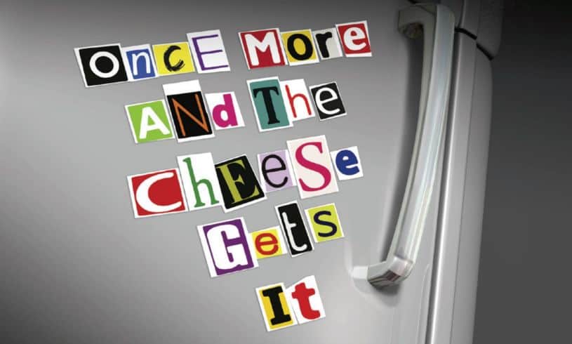 Cut out letters on grey fridge