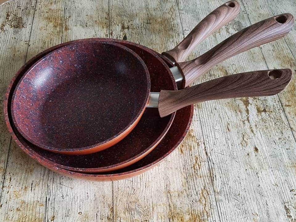 pile of JML copper stone pans