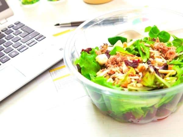 A bowl of salad on a table