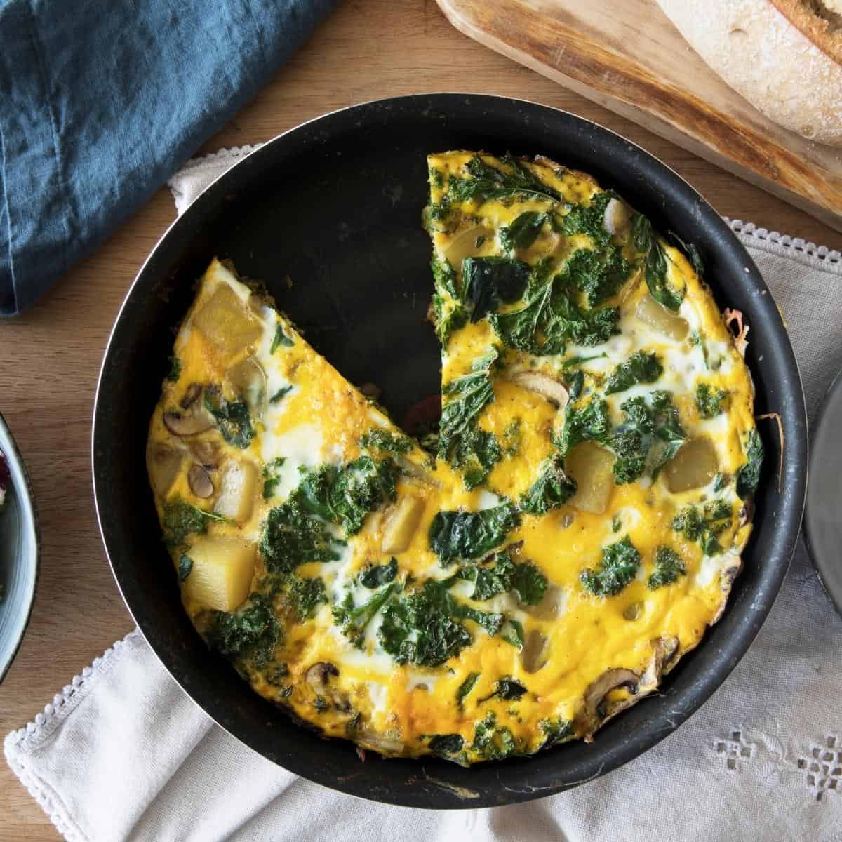 A frittata sitting on top of a wooden table