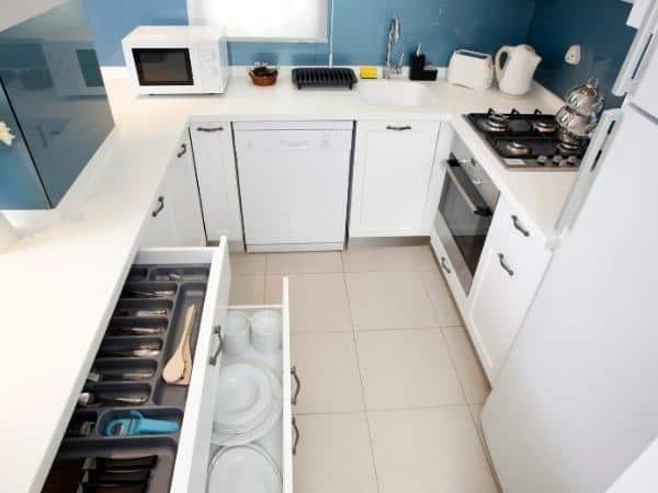 A stove top oven sitting inside of a kitchen