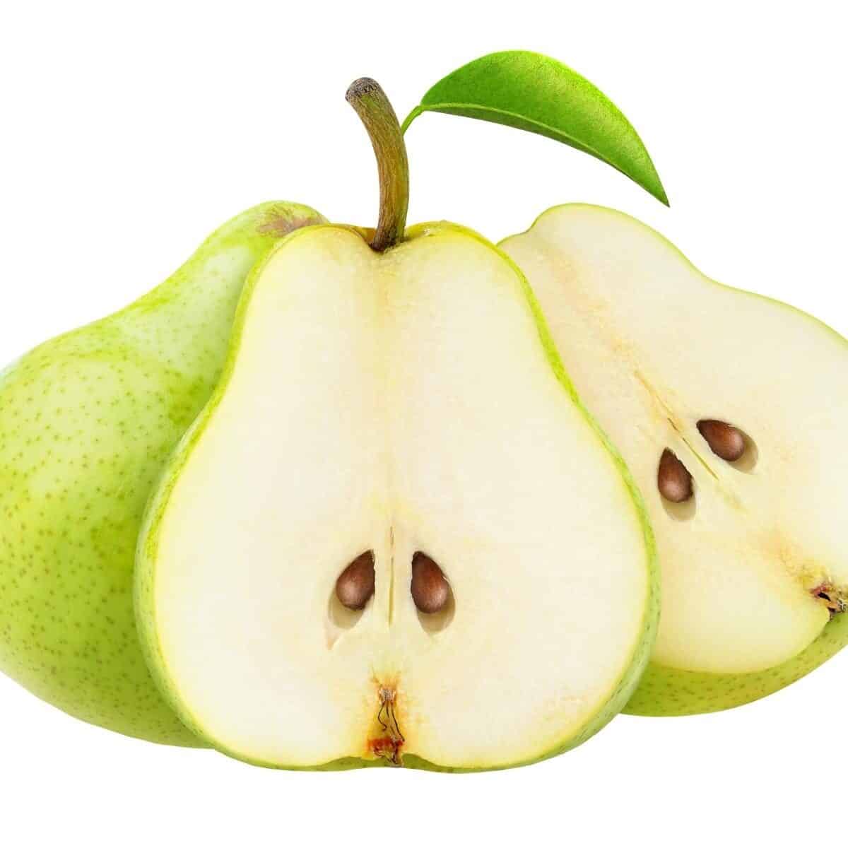 pears sliced in half on a white background.