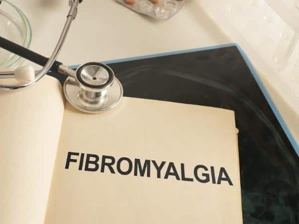 fibromyalgia on a notebook with a stethoscope