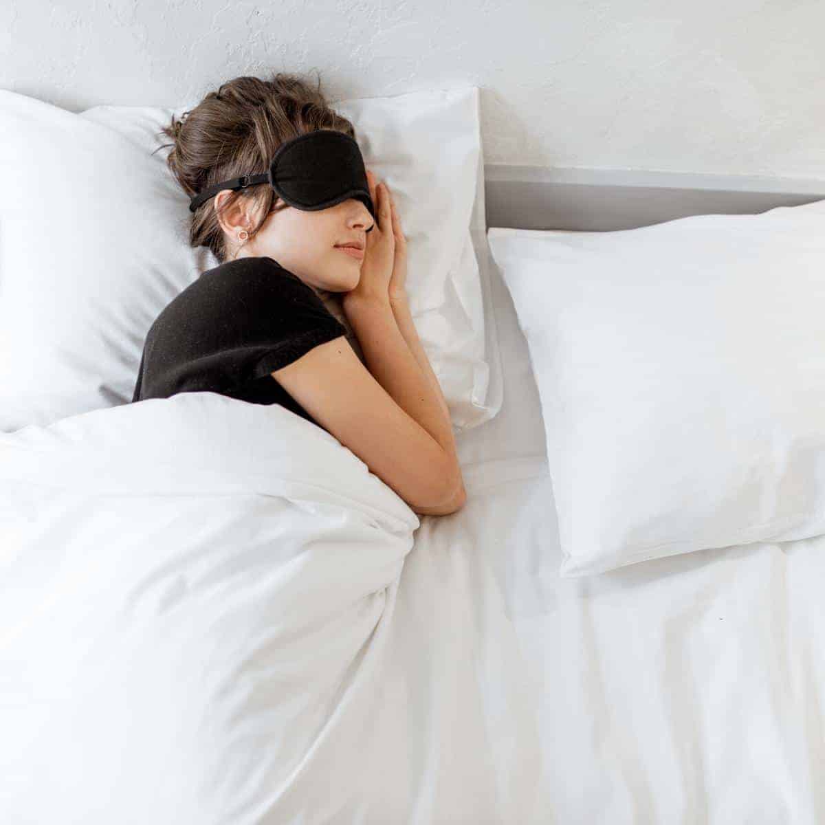 Sleeping lady in white beddiing