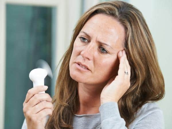 lady experiencing menopause weight loss hot flushes