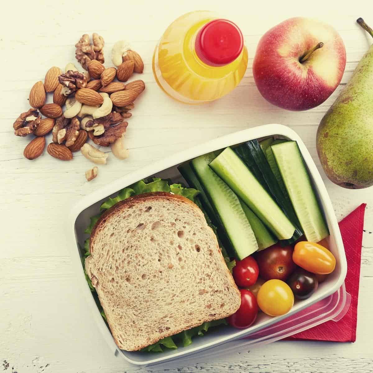 lunch box with sandwiches and fruit