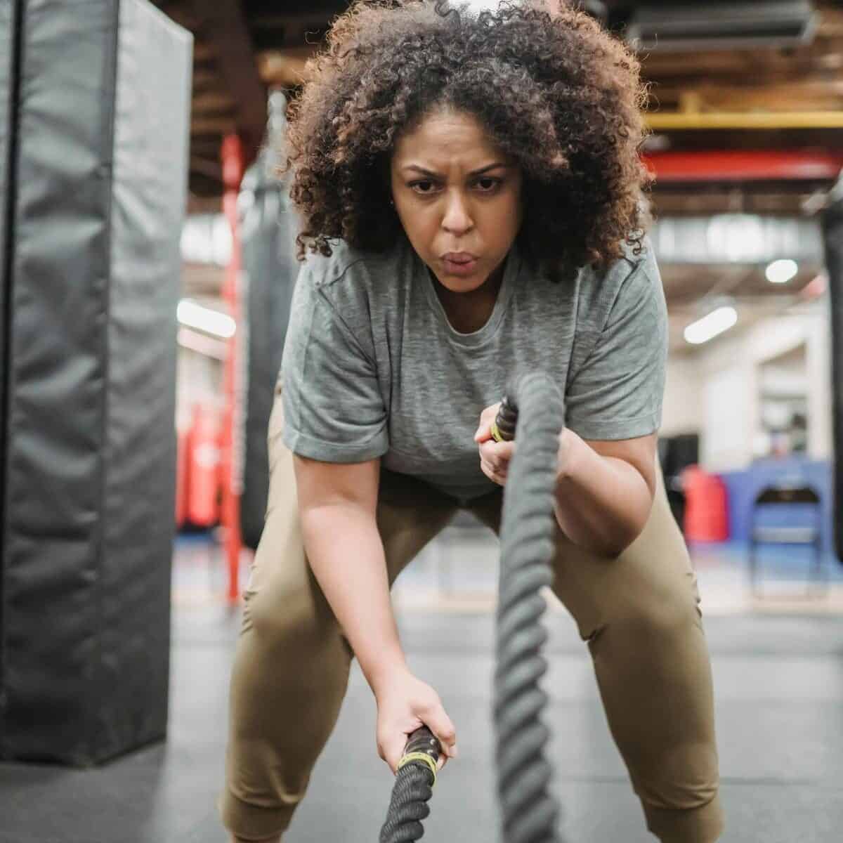 lady doing cardio workout with ropes
