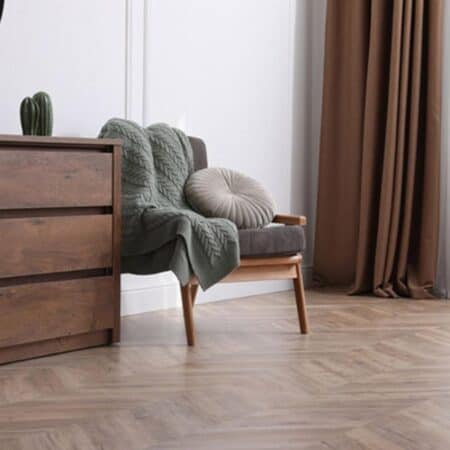 herringbone flooring in a bedroom