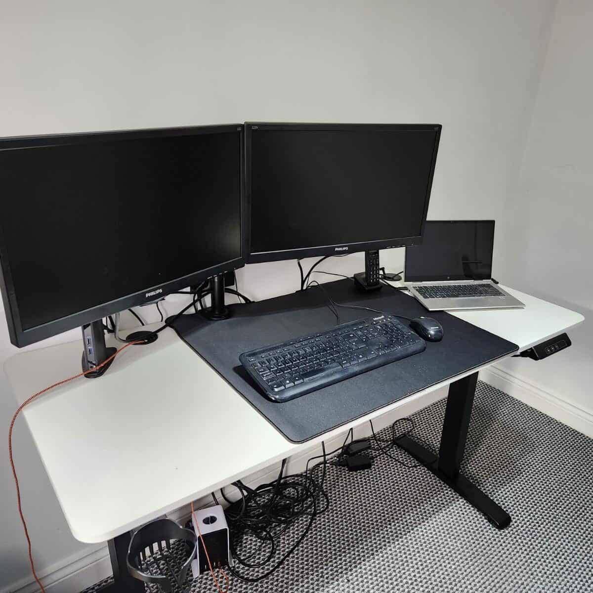 standing desk in a room with white walls