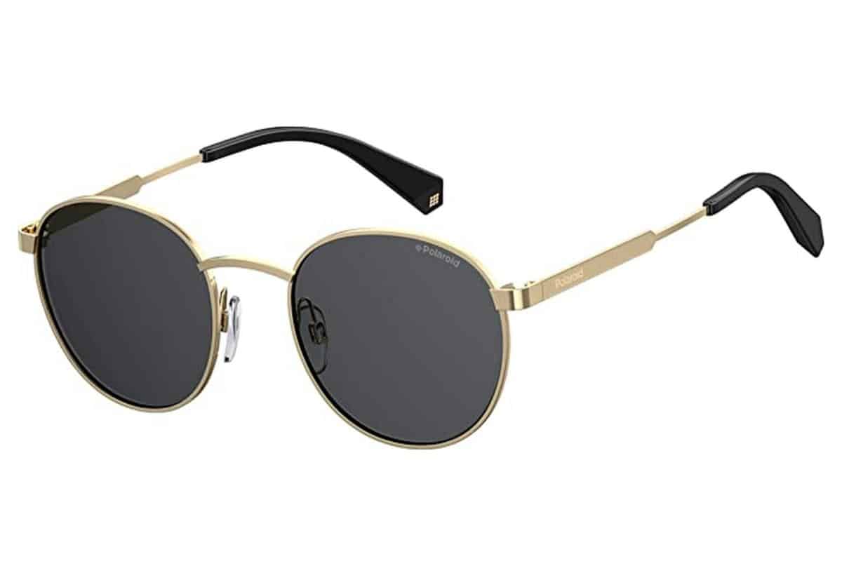Polaroid sunglasses with a gold coloured frame and blackened lenses.