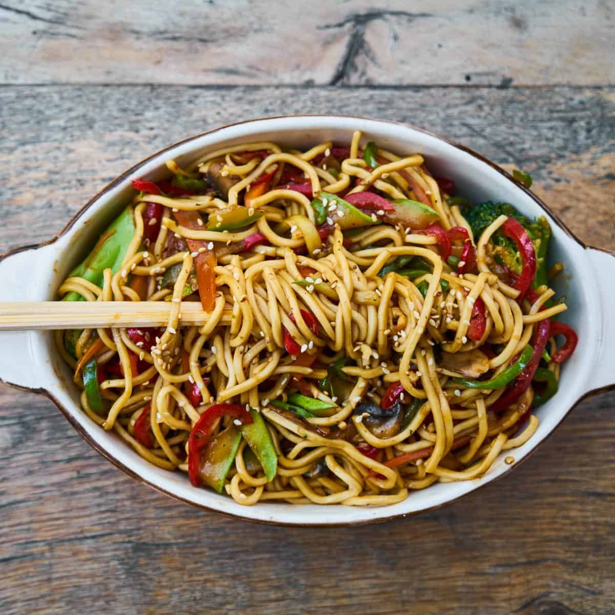 stir fry in an oval white bowl