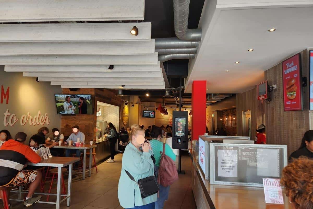 Slim chickens Nottingham inside the branch with people eating