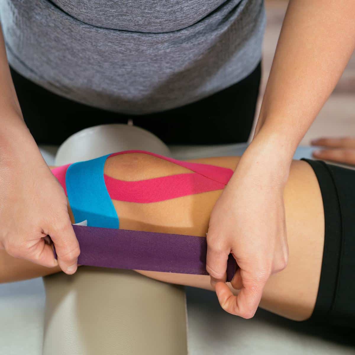 knee taped with kinesiology tape