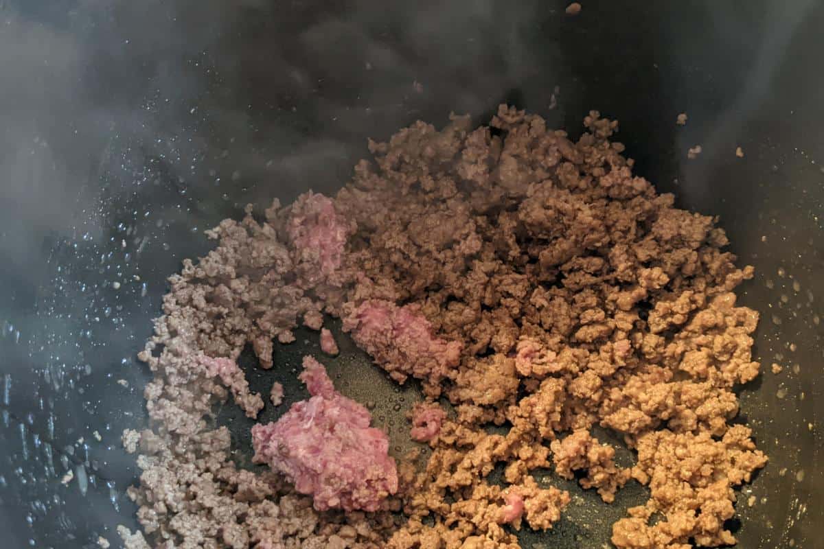 Mince partly browned in a frying pan.