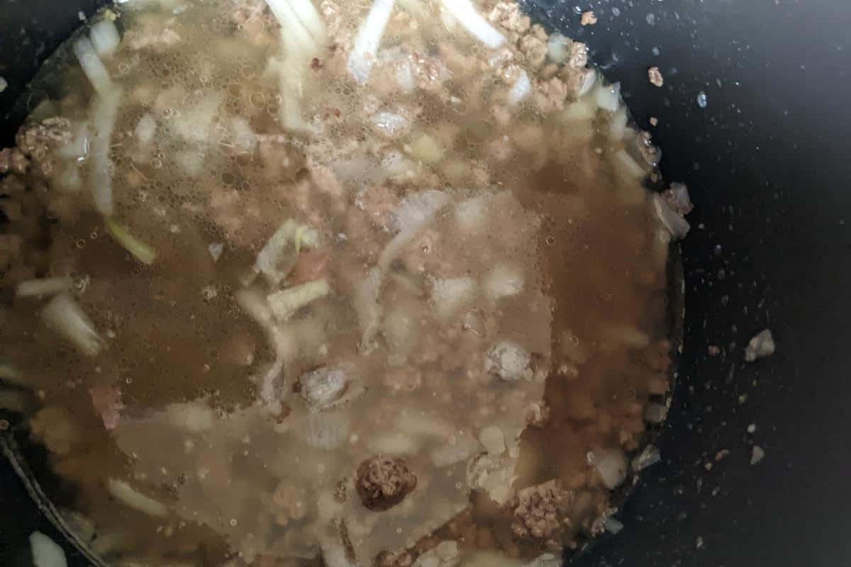 Stock, mince and onions in an Instant Pot.
