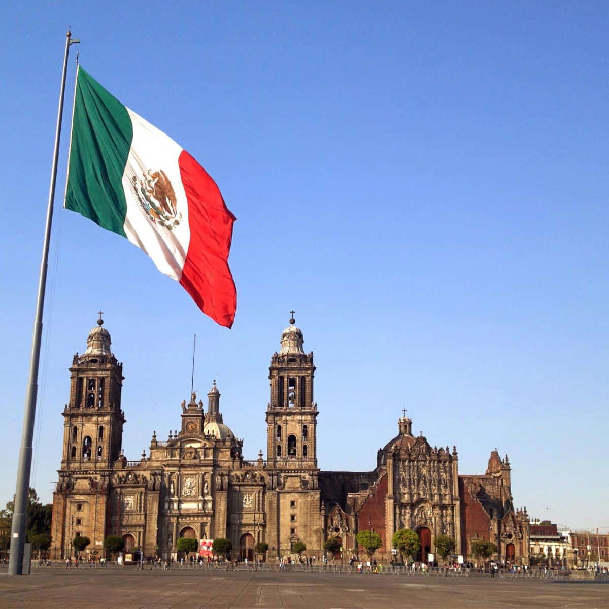 Popular building in Mexico with a Mexican flag flying in front
