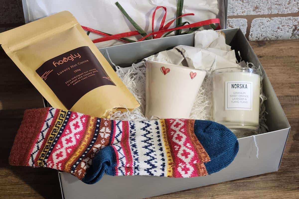 Cosy night in gift box with socks, candle, candle holder and hot chocolate mix.