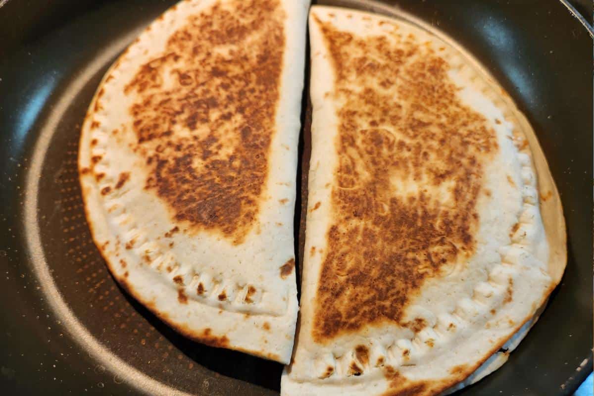 Two crimpit burritos in a se,micircle shape.