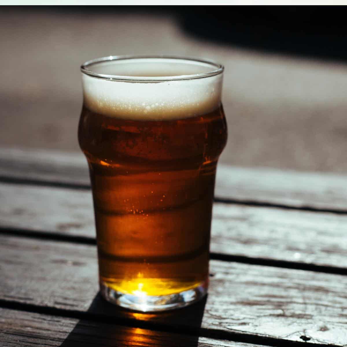 glass of beer on outside table