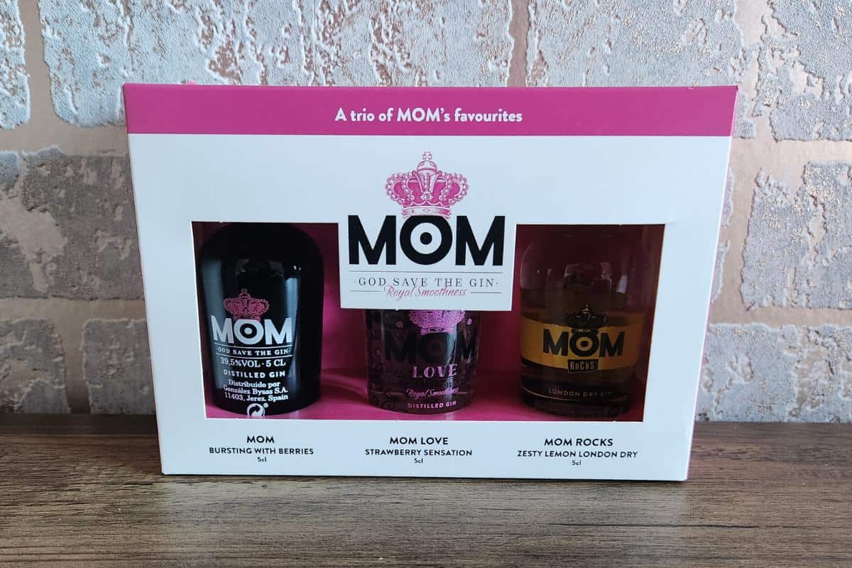 Box of three miniature gin bottles from the Mom brand.
