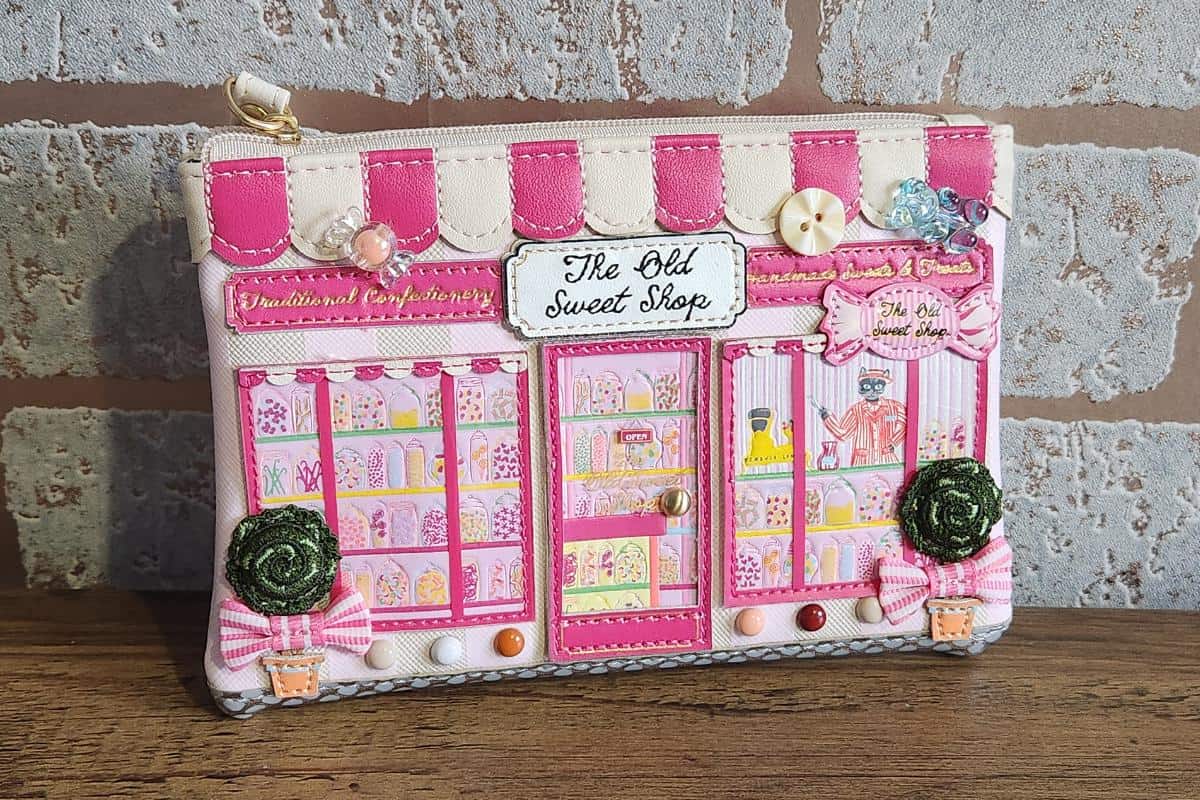 Vendula Sweet shop coin purse with an intricate sweet shop design in pinks on the front.