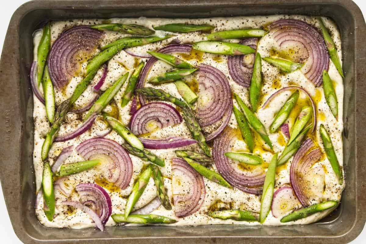 veg spread on focaccia dough.