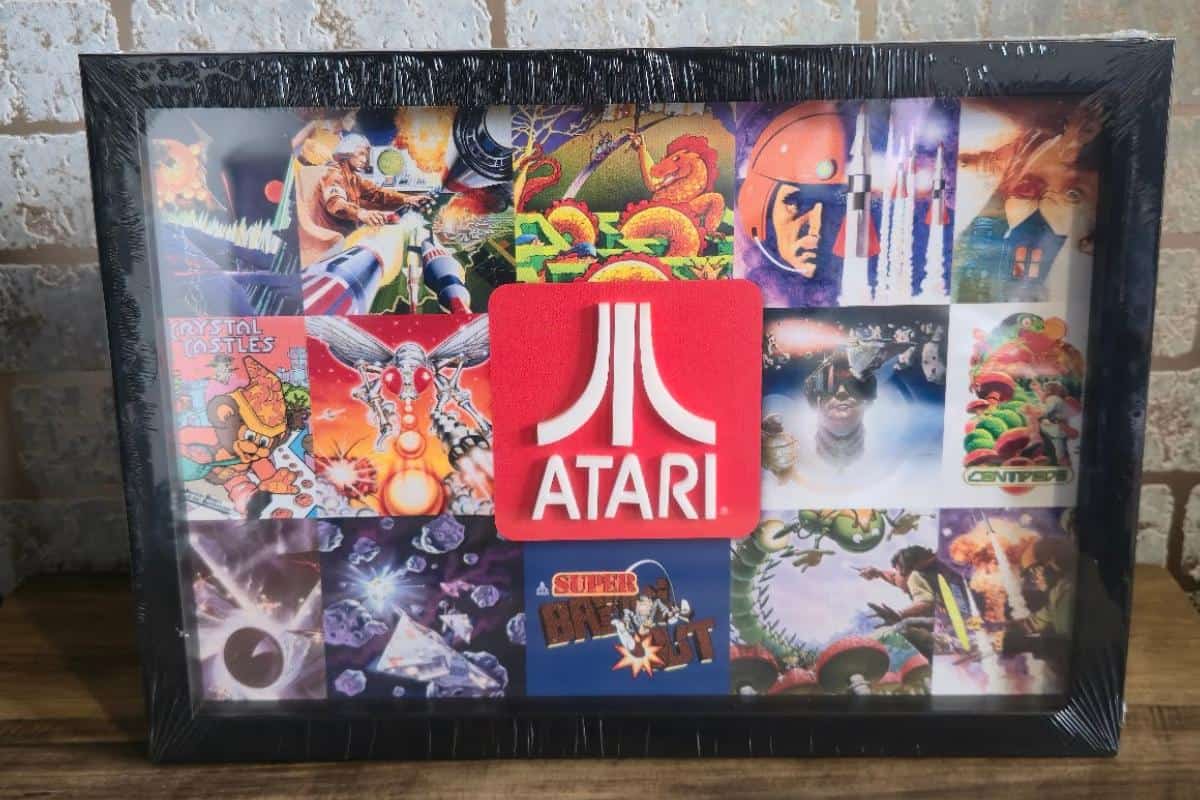 a framed picture of Atari video games