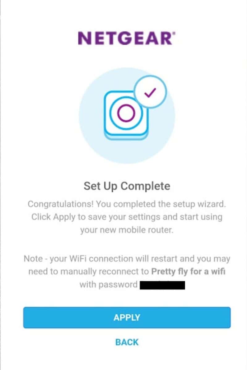 A NETGEAR setup screen with a checkmark icon states "Set Up Complete." Instructions say to click Apply to finish and reconnect to the mobile WiFi hotspot "Pretty fly for a wifi" using the shown password. Buttons for "APPLY" and "BACK" are at the bottom.