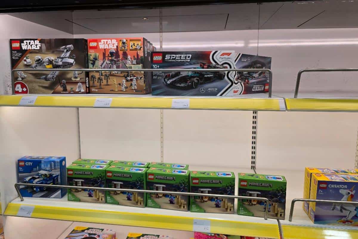 Various LEGO sets are displayed on store shelves, including Star Wars, Speed Champions, Minecraft, City, and Creator themes—each a colorful box sure to spark the imagination of any travel guide or inspire unique journeys like the Dover to Calais Ferry.