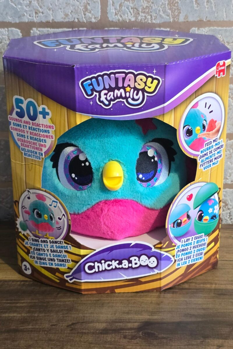 A Funtasy Family Chick-a-Boo plush toy in blue and pink is displayed in its colorful packaging, perfect for children's Christmas gifts. The box highlights its interactive features, over 50 sounds and reactions, with cartoon images and playful designs.