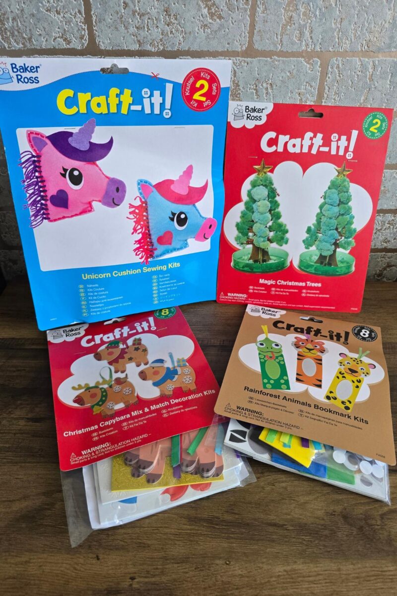 Four Baker Ross kids’ craft kits are displayed: a unicorn cushion sewing kit, magic Christmas trees kit, Christmas capybara mix & match decoration kit, and rainforest animals bookmark kit—perfect picks for any children's Christmas gifts list.