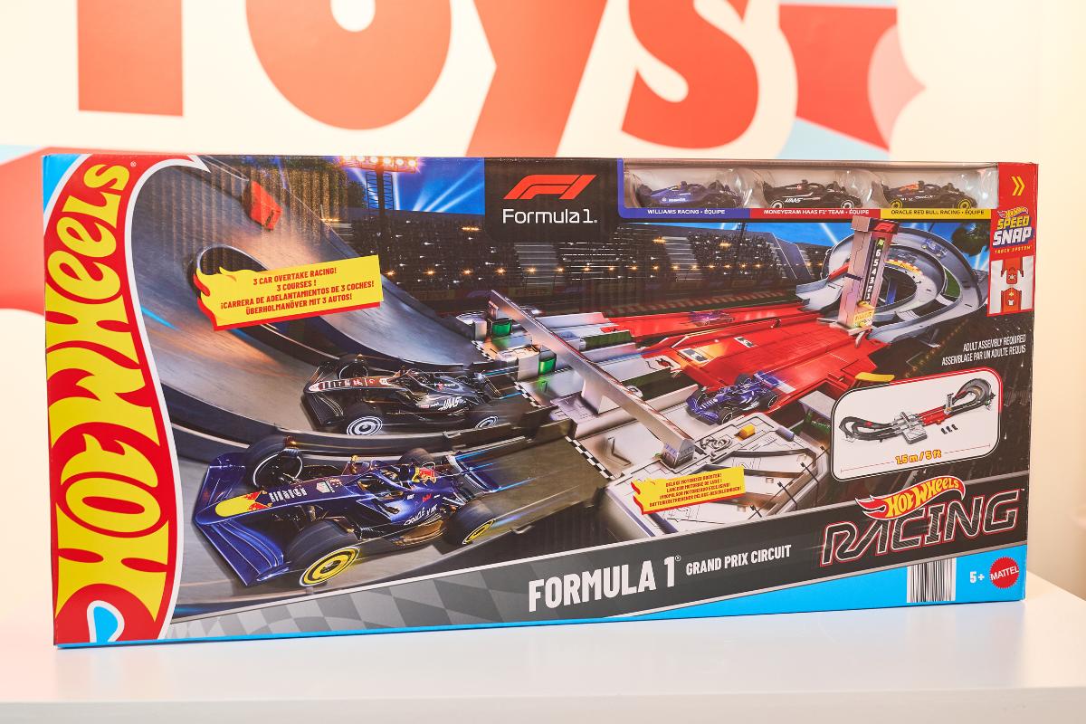A Hot Wheels Formula 1 Grand Prix Circuit racing track set is displayed in its colorful box, making it a must-have for kids and one of the Top Toys 2025—perfect for every Christmas List.