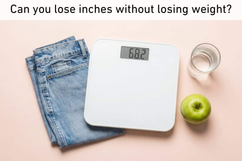 A set of scales displaying 68. 2, folded jeans, a glass of water, and a green apple on a light surface with the text, "can you lose inches without losing weight? " at the top—highlighting how exercise can help reshape your body even if the number on the scales stays the same.